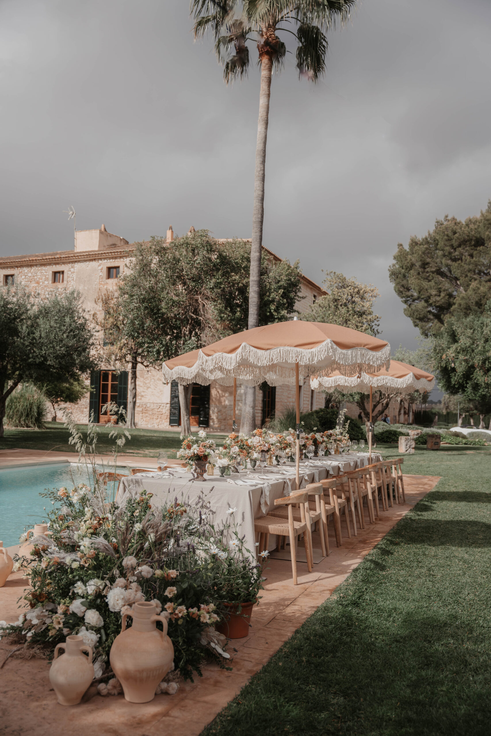 Finca Morneta Wedding Mallorca Charlotte Nelson Photography Pool Table Parasols Floor Flowers Terracotta