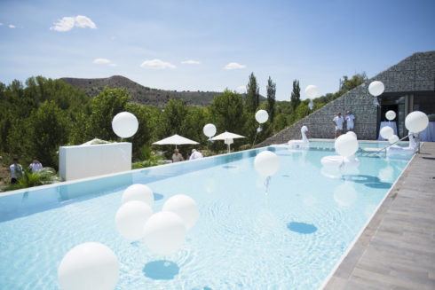 Castilla Termal Monasterio De Valbuena luxury wedding venue in spain. photo shows the pool with floating balloons