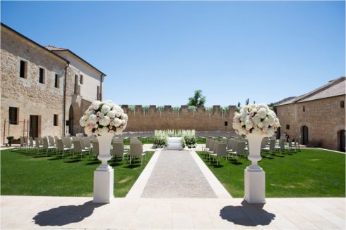 Luxury wedding destination in spain, set up for the ceremony florals with huge urns