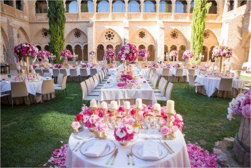 luxury wedding destination in Spain. full ultra opulent wedding breakfast with roses, peonies, hydrangeas and orchid cascades