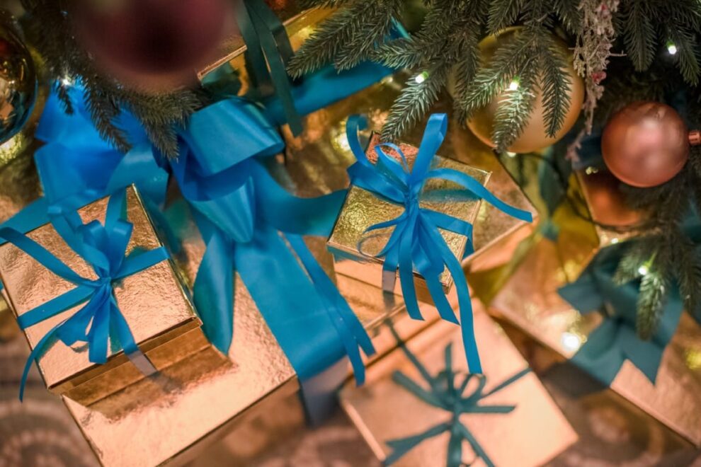 Stylishly wrapped presents under a christmas tree for a corporate installation