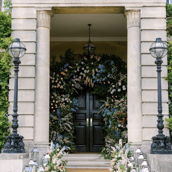 Pastel floral archway surrounds the entrance to Hedsor house. created by Paula Rooney Floral design