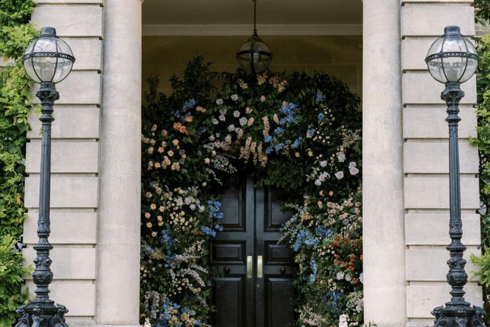 Pastel floral archway surrounds the entrance to Hedsor house. created by Paula Rooney Floral design