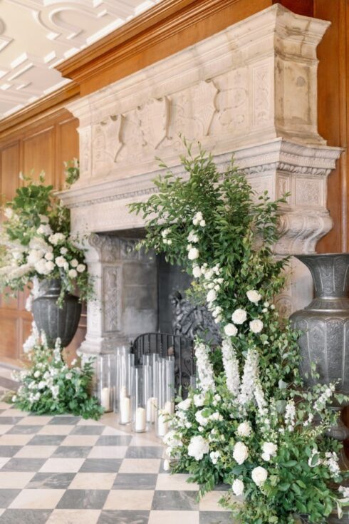 Impressive white and green fireplace floral design at North Mymms Park