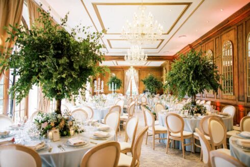 Whimsical woodland wedding trees adorn the tables for the wedding breakfast reception at Hedsor House