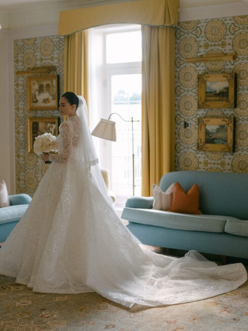 Bride dressed in couture gown at Four Seasons Hampshire with garden rose bouquet by Paula Rooney