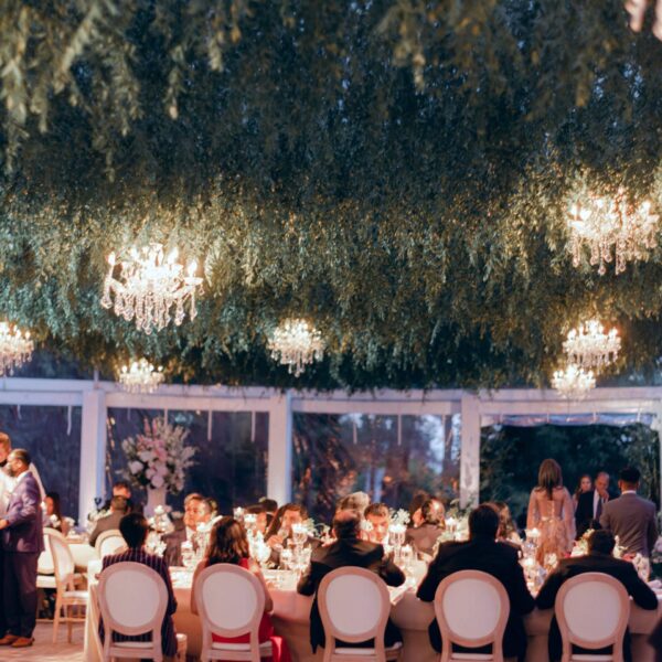 A floating greenery marquee ceiling with crystal chandeliers at Multi-cultural and Multi Day Wedding
