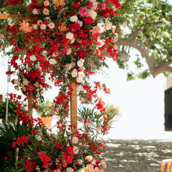 Jardines de Alfabia Wedding Mallorca Violeta Minnick Photography Red Pink Cream Orange Natural Flower Arch Backdrop