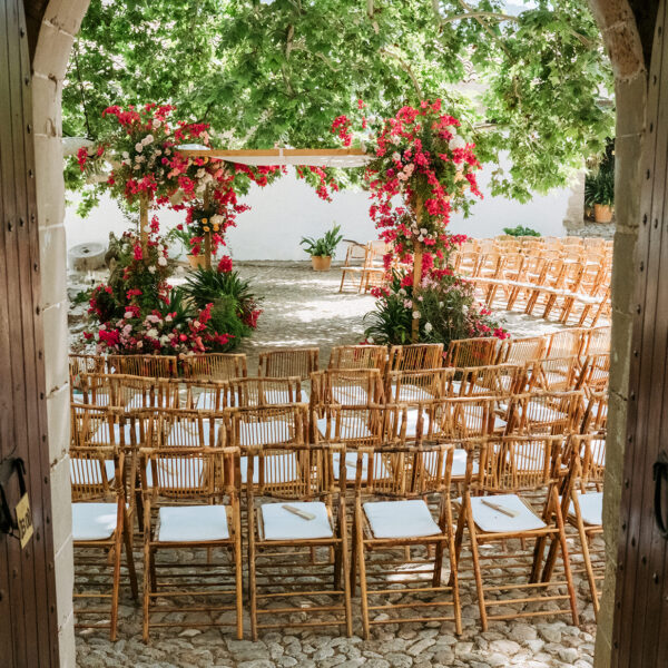 Jardines de Alfabia Wedding Mallorca Violeta Minnick Photography Red Pink Cream Orange Natural Flower Arch Backdrop Ceremony Chairs Set Up