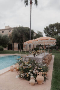 Finca Morneta Wedding Mallorca Charlotte Nelson Photography Pool Table Parasols Floor Flowers Terracotta