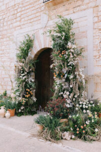 Finca Morneta Wedding Mallorca Ross Hurley Photography Flower Pillars Arch Door Greenery Cream Toffee Wild Natural