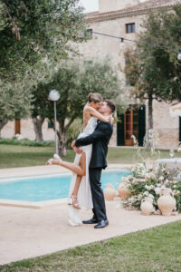 Finca Morneta Wedding Mallorca (c)Liz Greenhalgh Photography Pool Bride Groom Kiss