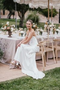 Finca Morneta Wedding Mallorca (c)Liz Greenhalgh Photography Seated Bride Table Decor Flowers Outdoors